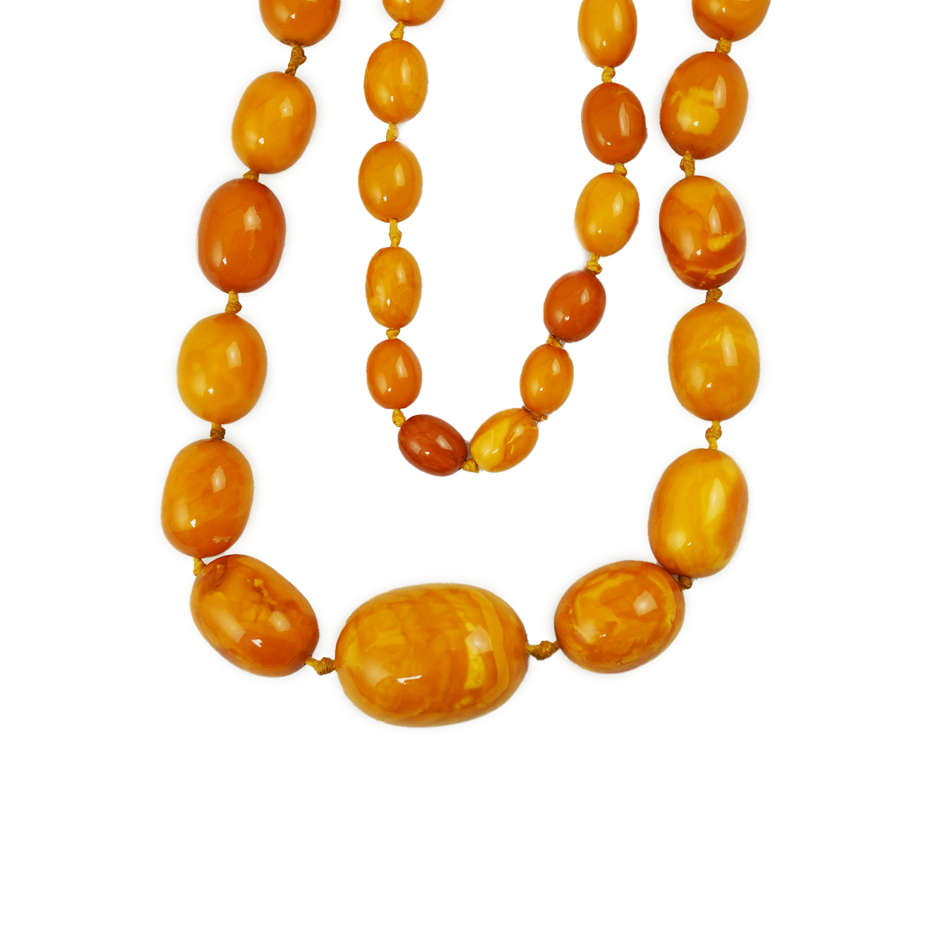 A single strand graduated oval amber bead necklace